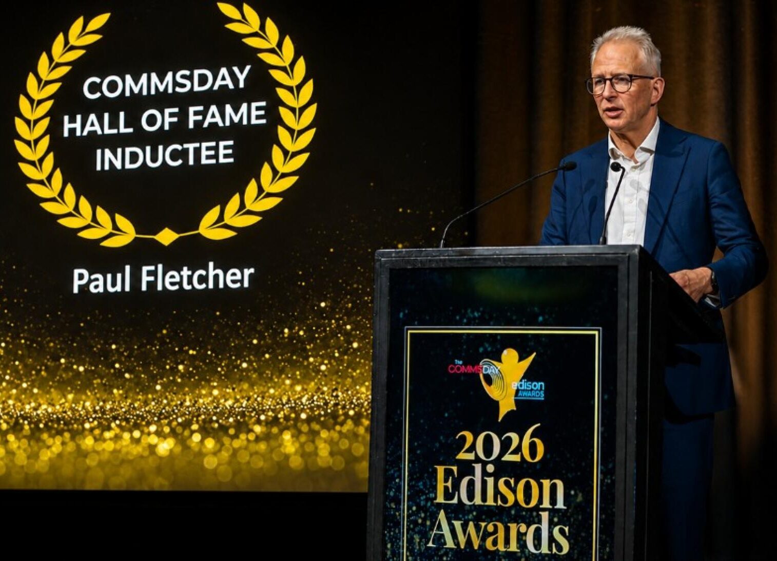 Paul Fletcher speaking at the CommsDay Hall of Fame event